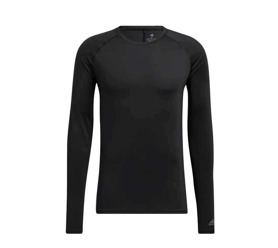 adidas men's long-sleeve black compression UV golf innerwear base layer shirt featuring raglan sleeves, crew neck collar, and a subtle adidas logo near the sleeve cuff.